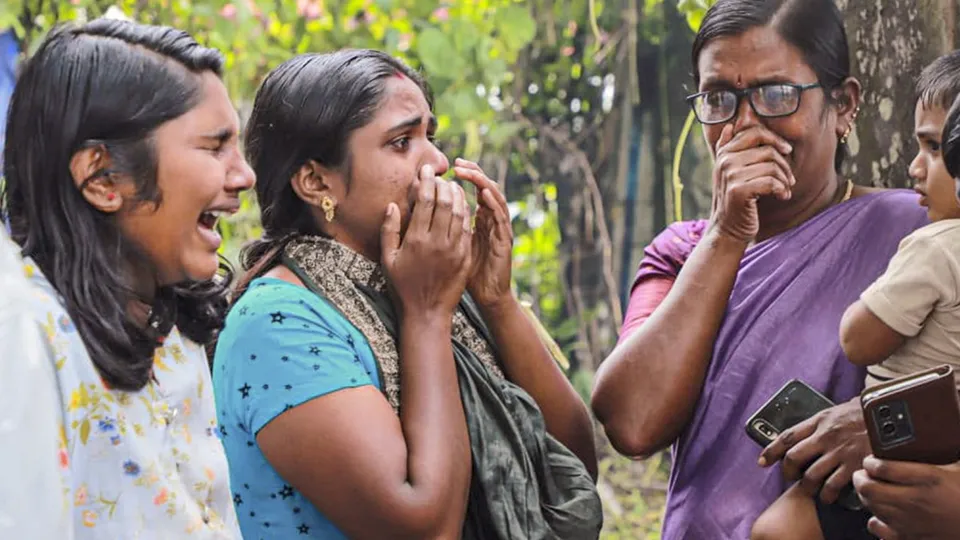 Family members and relatives of the recent landslides victims mourn at a crematorium, at Chooralmala, in Wayanad district