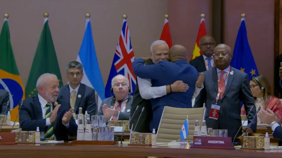 Prime Minister Narendra Modi hugs President of the Union of Comoros and Chairperson of the African Union (AU) Azali Assoumani