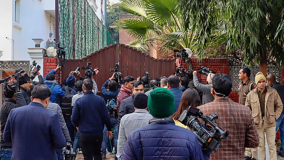 Media outside Jharkhand Chief Minister Hemant Soren's residence where an ED team reached, in New Delhi, Monday, Jan. 29, 2024. ED has summoned Soren for questioning in connection with a maoney laundering case. 