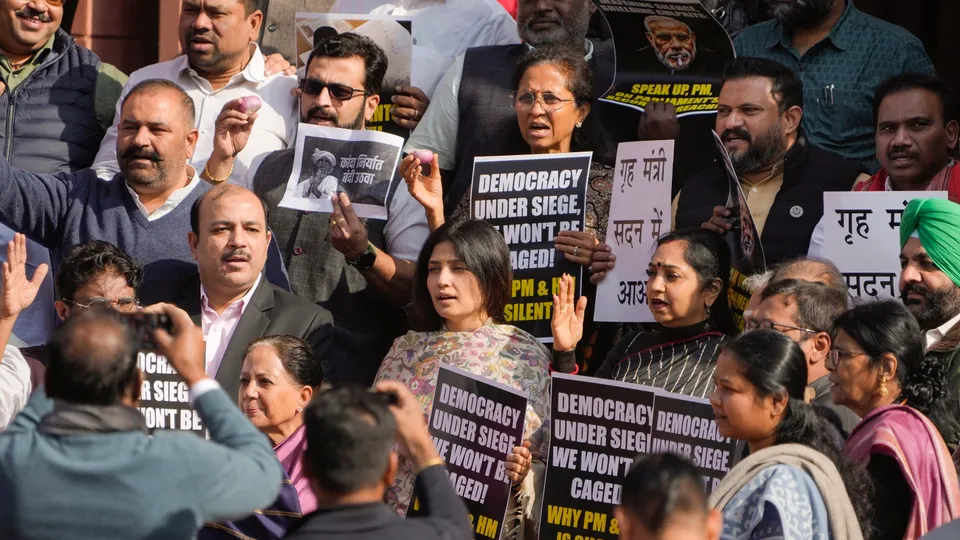 Suspended opposition MPs protest during the Winter session of Parliament