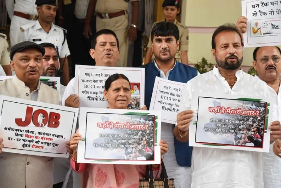 RJD leader Rabri Devi with party leaders stage a protest over the issue of unemployment during the ongoing Monsoon session of the Assembly, in Patna