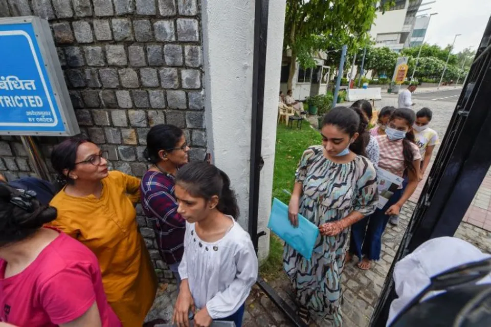 Students come out after appearing for the Common University Entrance Test-Undergraduate (CUET UG 2022), in the first slot, at North Campus in New Delhi, Friday, July 15, 2022. The first phase of the Common University Entrance Test, a common gateway for undergraduate admissions in all central universities, began Friday across 500 centres in India and 10 abroad.