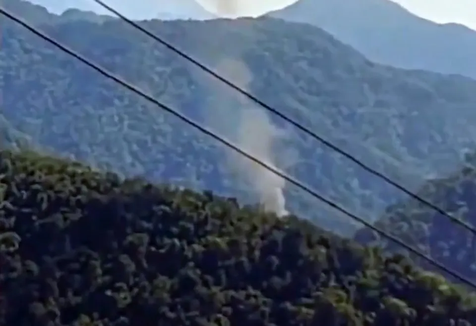 Smoke billows after an advanced light helicopter of the Indian Army crashed at Migging in Upper Siang district of Arunachal Pradesh,