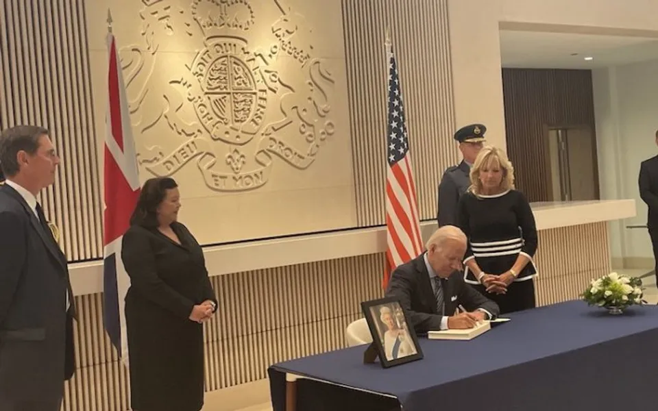 Joe Biden signs a condolence book at the British embassy in DC