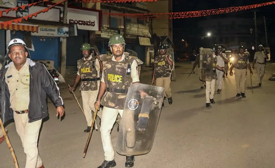 Security personel maintain law and order after violence in Hubballi