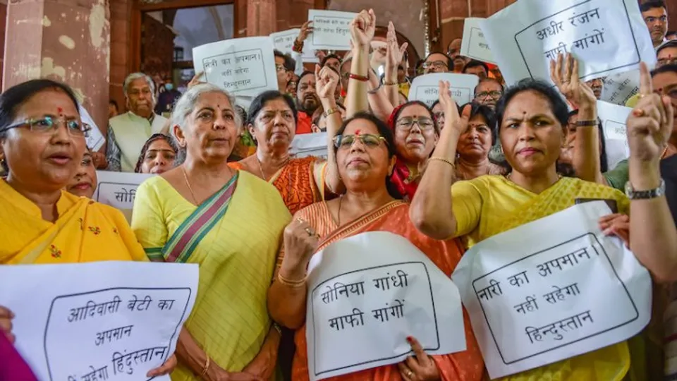 Union Finance Minister Nirmala Sitharaman with other BJP MPs during a protest against Congress leader Adhir Ranjan Chowdhurys remarks on President Droupadi Murmu, at Parliament House, in New Delhi, Thursday