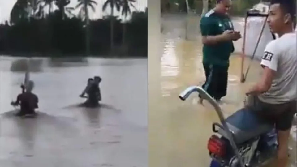 കഴുത്തോളം വെളളം, ഹാന്‍ഡിലും മറഞ്ഞ് ഒഴുക്ക്; വെളളപ്പൊക്കത്തിലൂടെ ബൈക്ക് ഓടിച്ച് യുവാക്കള്‍