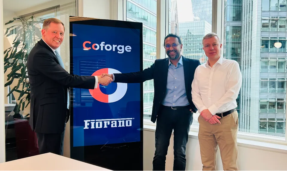 Edward Davies and Biju Suresh Babu at the signing ceremony
