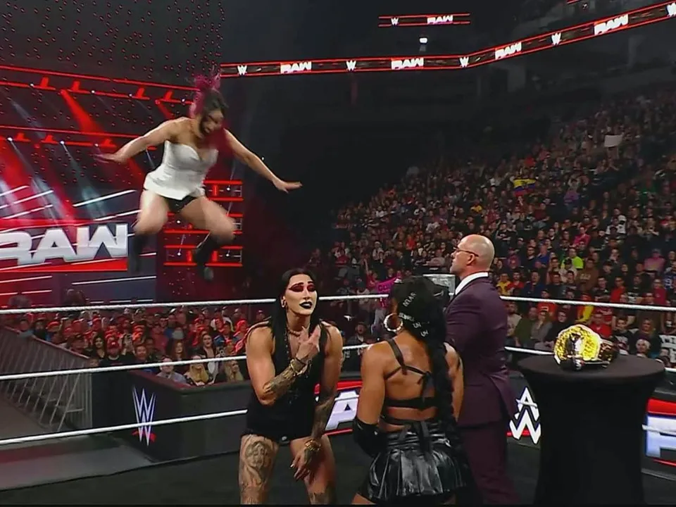 Iyo Sky attacks on Rhea Ripley and Bianca Belair after signing the contract for WrestleMania 41 