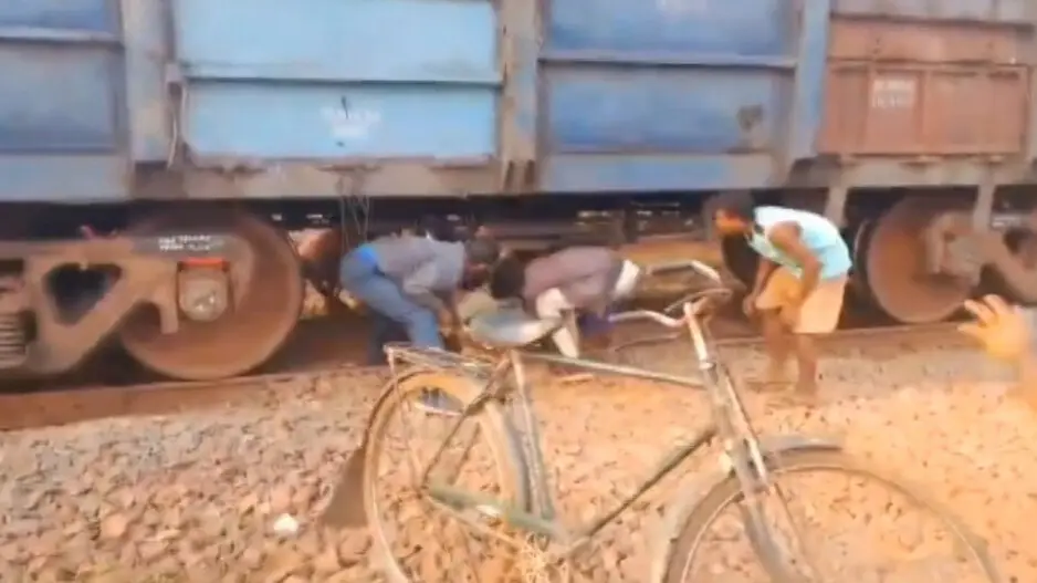 Menace of non-motorable road: Patient carried beneath halted goods train to reach ambulance in Odisha